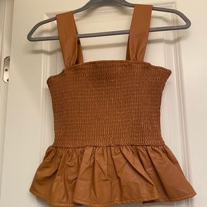 Leather Peplum top. NWT